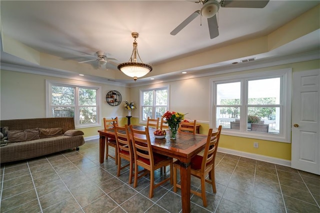 3265 Bethesda Park Ct, Lawrenceville, GA 30044 - dining space with a raised ceiling, ceiling fan, crown molding, healthy amount of natural light, and baseboards