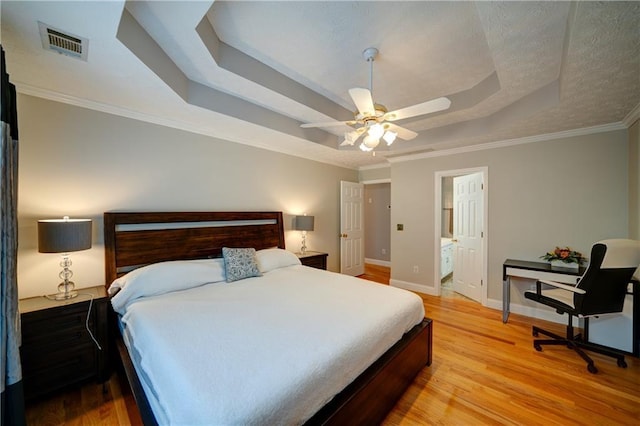 3265 Bethesda Park Ct, Lawrenceville, GA 30044 - bedroom with a tray ceiling, baseboards, light wood-style flooring, crown molding, and a ceiling fan