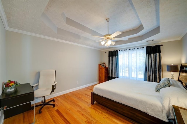 3265 Bethesda Park Ct, Lawrenceville, GA 30044 - bedroom featuring a tray ceiling, light wood-style flooring, baseboards, crown molding, and ceiling fan