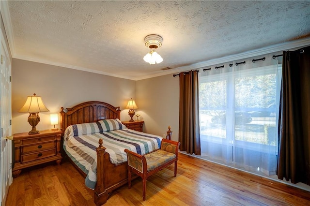 3265 Bethesda Park Ct, Lawrenceville, GA 30044 - bedroom with light wood finished floors, a textured ceiling, and ornamental molding