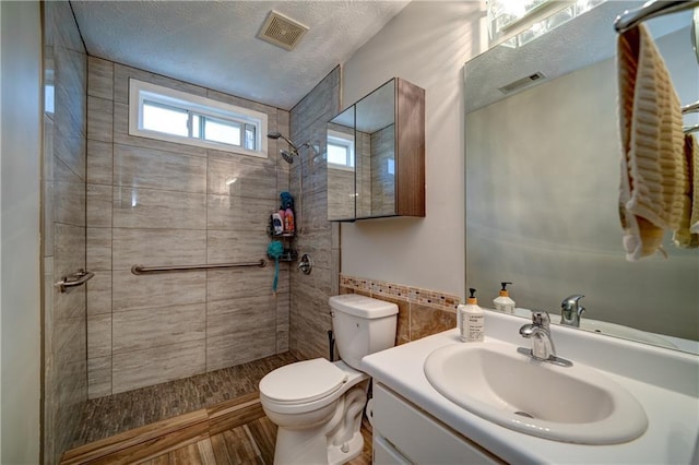 3265 Bethesda Park Ct, Lawrenceville, GA 30044 - bathroom with a tile shower, toilet, and vanity