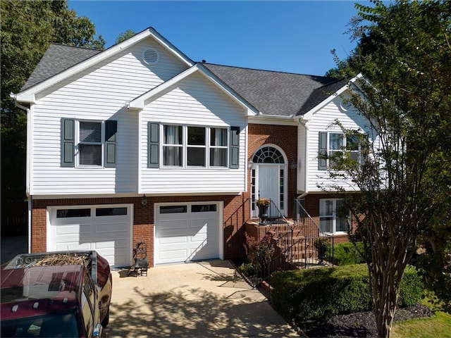 3265 Bethesda Park Ct, Lawrenceville, GA 30044 - raised ranch featuring brick siding, concrete driveway, and an attached garage