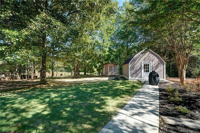 3265 Bethesda Park Ct, Lawrenceville, GA 30044 - view of grassy yard with a storage shed and an outdoor structure