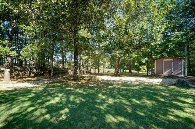 3265 Bethesda Park Ct, Lawrenceville, GA 30044 - view of grassy yard featuring a storage shed and an outbuilding