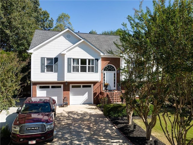 3265 Bethesda Park Ct, Lawrenceville, GA 30044 - bi-level home with brick siding, concrete driveway, a garage, and roof with shingles