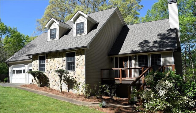 1521 Larkwood Dr, Canton, GA 30114 - view of front of house with a shingled roof, an attached garage, stone siding, a chimney, and a front lawn