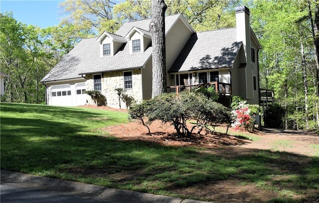 1521 Larkwood Dr, Canton, GA 30114 - view of front of house with a wooden deck, a front lawn, an attached garage, a chimney, and a shingled roof