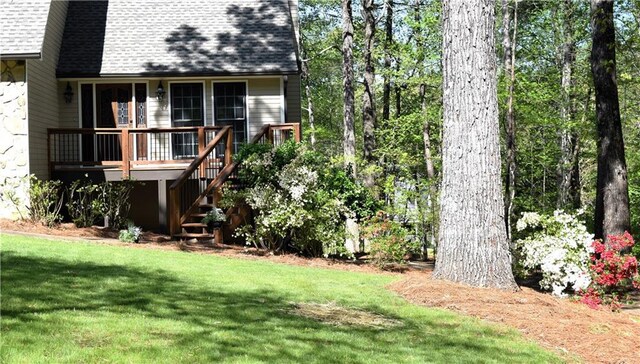 1521 Larkwood Dr, Canton, GA 30114 - rear view of property featuring a shingled roof, a deck, a lawn, and stairs