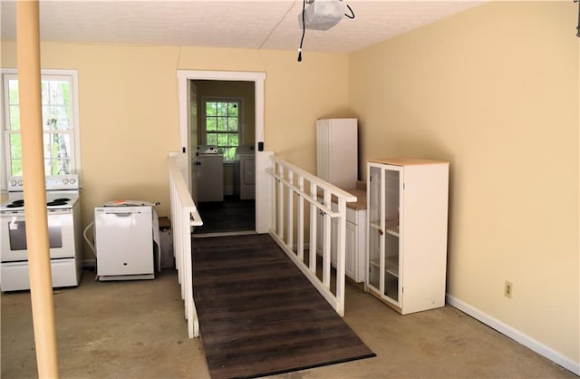 1521 Larkwood Dr, Canton, GA 30114 - stairs featuring baseboards, washing machine and dryer, and unfinished concrete floors