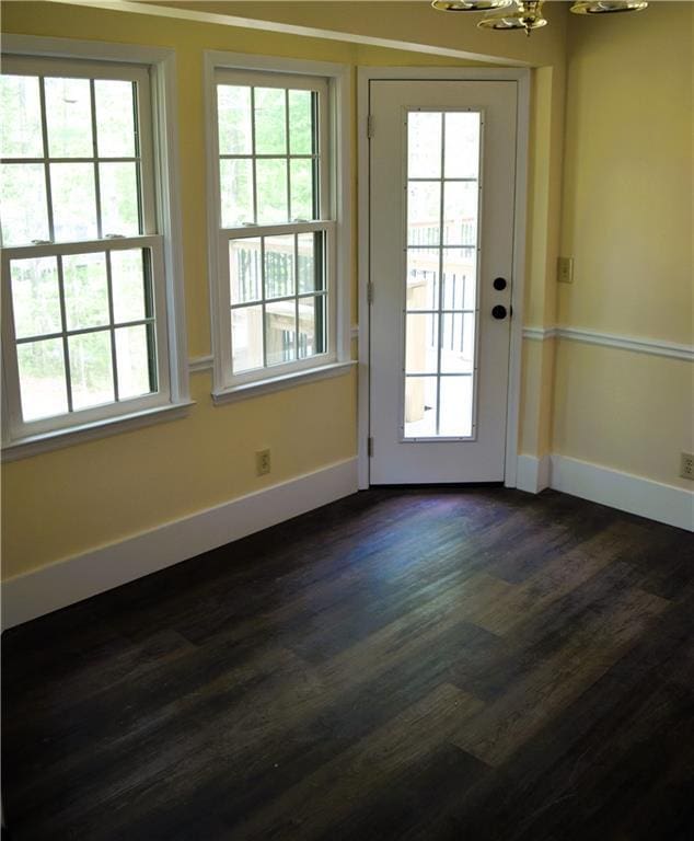 1521 Larkwood Dr, Canton, GA 30114 - doorway to outside with dark wood-style flooring, a notable chandelier, and baseboards