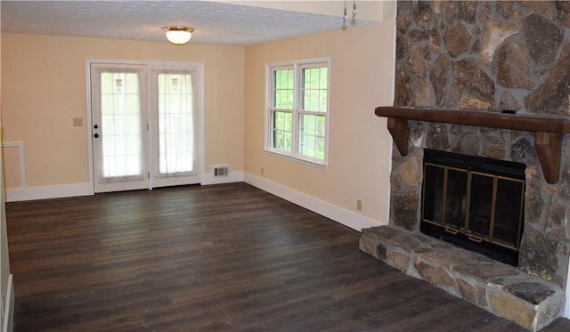 1521 Larkwood Dr, Canton, GA 30114 - unfurnished living room with a fireplace, visible vents, baseboards, and wood finished floors