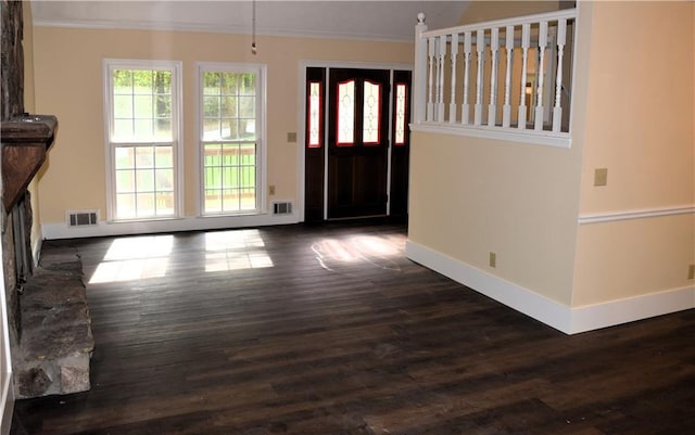 1521 Larkwood Dr, Canton, GA 30114 - entrance foyer with dark wood-style flooring, ornamental molding, baseboards, and visible vents