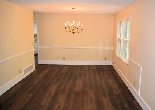 1521 Larkwood Dr, Canton, GA 30114 - unfurnished dining area featuring an inviting chandelier, baseboards, dark wood finished floors, and visible vents