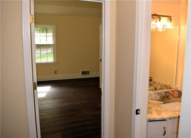 1521 Larkwood Dr, Canton, GA 30114 - corridor with baseboards, a sink, dark wood finished floors, and visible vents