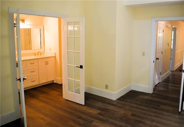 1521 Larkwood Dr, Canton, GA 30114 - corridor featuring french doors, baseboards, a sink, and dark wood finished floors