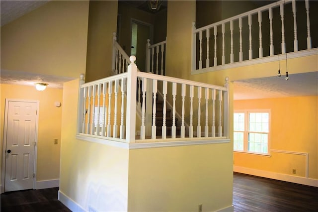 1521 Larkwood Dr, Canton, GA 30114 - stairs with a high ceiling, baseboards, and wood finished floors