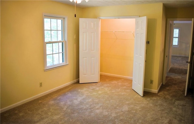 1521 Larkwood Dr, Canton, GA 30114 - unfurnished bedroom with a closet, baseboards, and carpet floors
