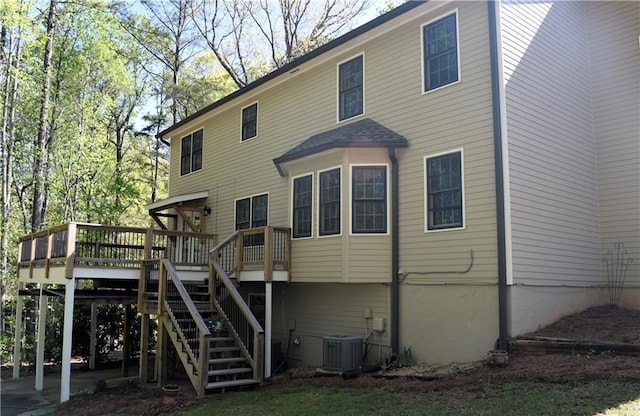 1521 Larkwood Dr, Canton, GA 30114 - back of house with central AC unit, a deck, and stairs
