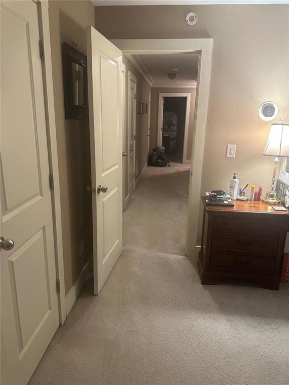 corridor featuring light carpet
