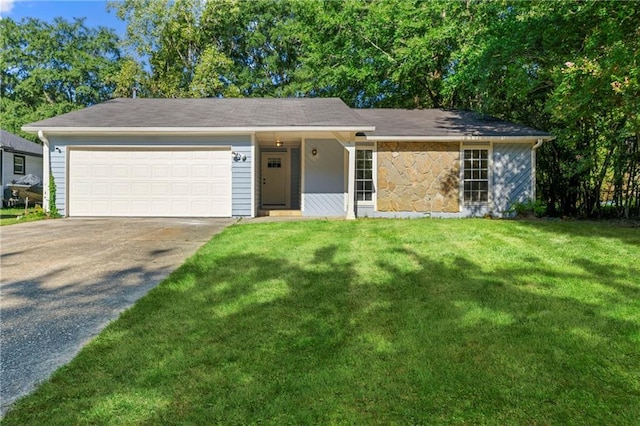 single story home with a garage and a front lawn