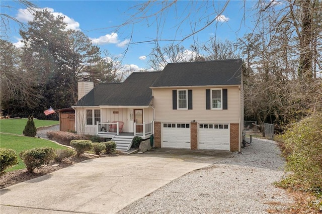 split level home with a garage, brick siding, concrete driveway, board and batten siding, and a chimney