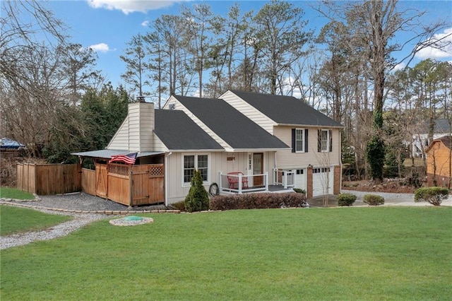 view of front of home with an attached garage, a chimney, a front yard, and fence