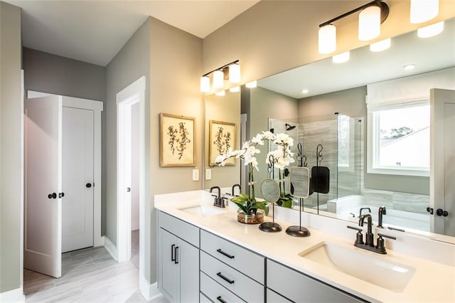 bathroom featuring independent shower and bath and vanity