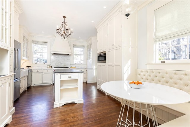 kitchen featuring dark wood-style floors, custom exhaust hood, open shelves, decorative backsplash, and white cabinets