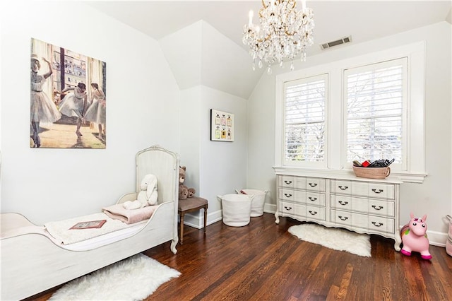 bedroom with visible vents, baseboards, lofted ceiling, wood finished floors, and a notable chandelier