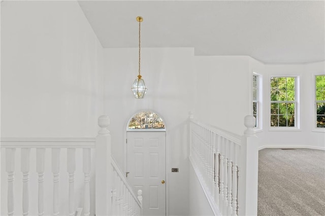 305 Bridgewater Ter, Canton, GA 30115 - staircase featuring plenty of natural light, carpet, and a chandelier