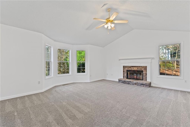 305 Bridgewater Ter, Canton, GA 30115 - unfurnished living room with carpet, a ceiling fan, vaulted ceiling, and a stone fireplace