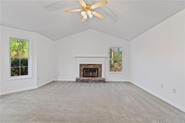 305 Bridgewater Ter, Canton, GA 30115 - unfurnished living room featuring carpet floors, ceiling fan, a stone fireplace, and vaulted ceiling