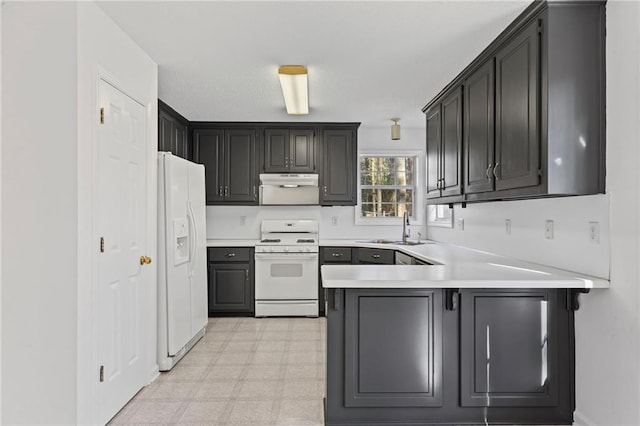 305 Bridgewater Ter, Canton, GA 30115 - kitchen with white appliances, a peninsula, under cabinet range hood, light countertops, and light flooring