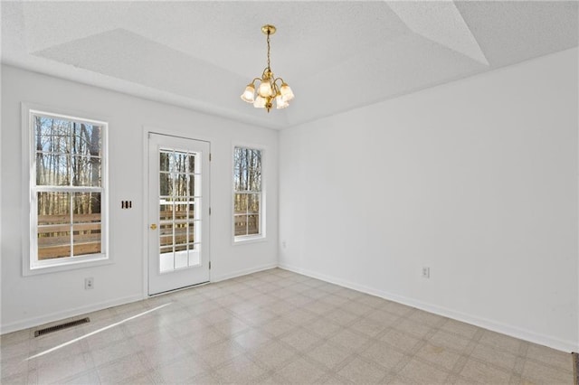 305 Bridgewater Ter, Canton, GA 30115 - unfurnished room featuring a chandelier, plenty of natural light, and tile patterned floors