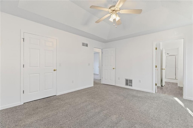 305 Bridgewater Ter, Canton, GA 30115 - unfurnished bedroom featuring carpet floors, a tray ceiling, ceiling fan, and ensuite bath