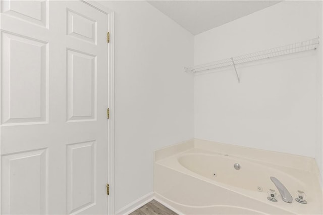 305 Bridgewater Ter, Canton, GA 30115 - bathroom with a jetted tub and wood finished floors