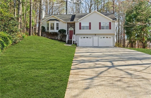 305 Bridgewater Ter, Canton, GA 30115 - split foyer home featuring concrete driveway, a garage, and a front yard