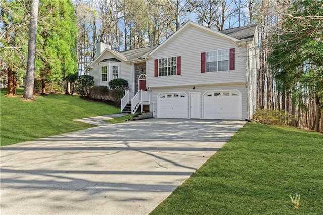 305 Bridgewater Ter, Canton, GA 30115 - bi-level home featuring a chimney, concrete driveway, an attached garage, and a front lawn