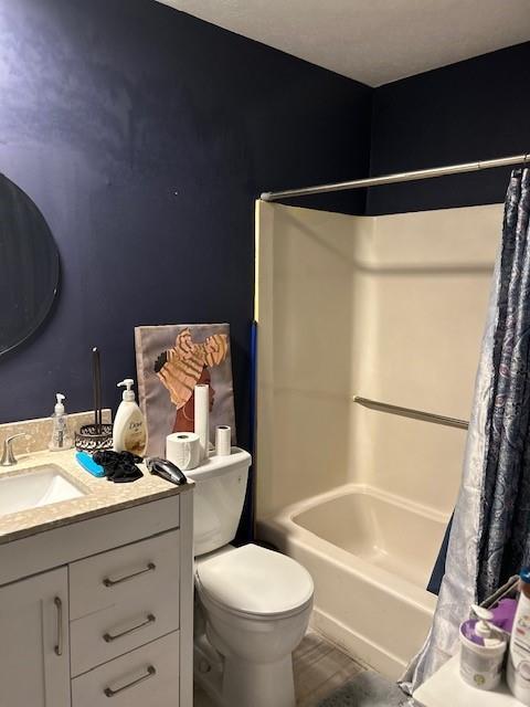 full bathroom featuring vanity, toilet, and shower / bath combo with shower curtain