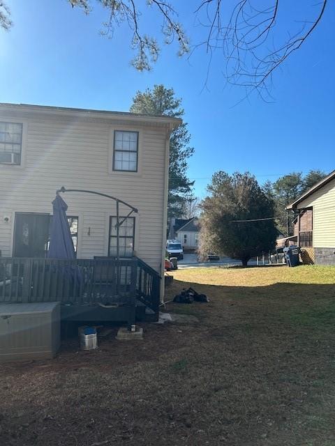 view of property exterior featuring a lawn