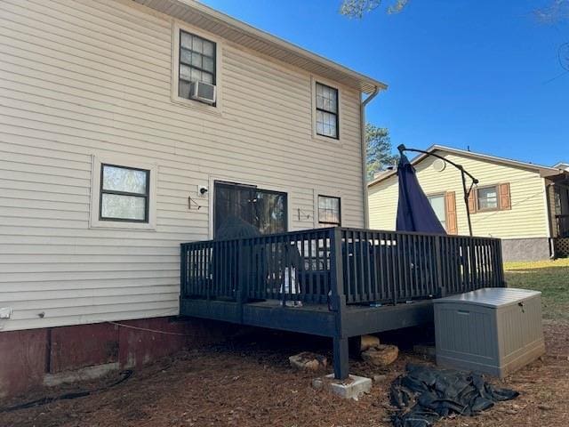 rear view of house featuring a deck