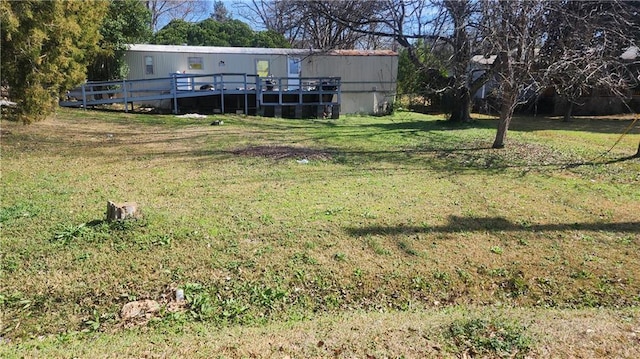 view of yard featuring a deck