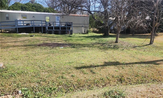 view of yard with a deck