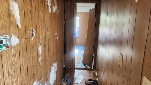 room details featuring hardwood / wood-style floors and wood walls