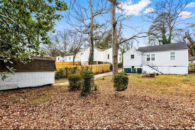 1380 Westmont Rd SW, Atlanta, GA 30311 - view of yard featuring a shed, cooling unit, an outdoor structure, fence, and a residential view