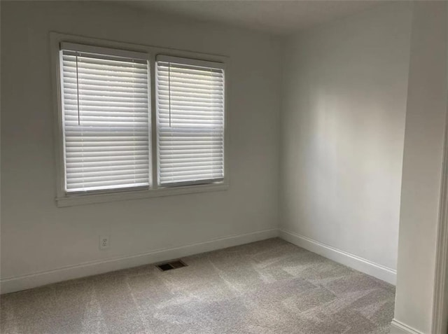 1380 Westmont Rd SW, Atlanta, GA 30311 - spare room featuring plenty of natural light, baseboards, light colored carpet, and visible vents
