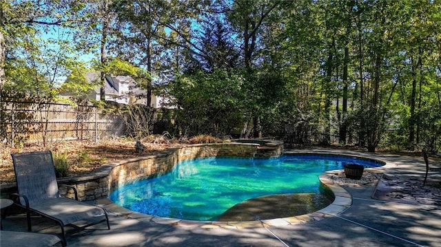 view of swimming pool featuring a patio area