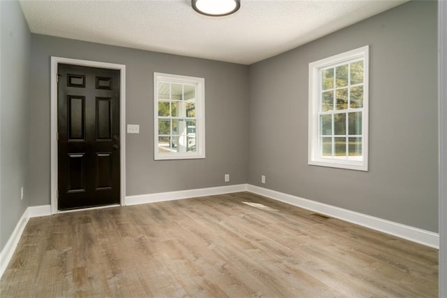 1912 Wax Rd, Aragon, GA 30113 - entrance foyer featuring light wood-type flooring, baseboards, and a textured ceiling