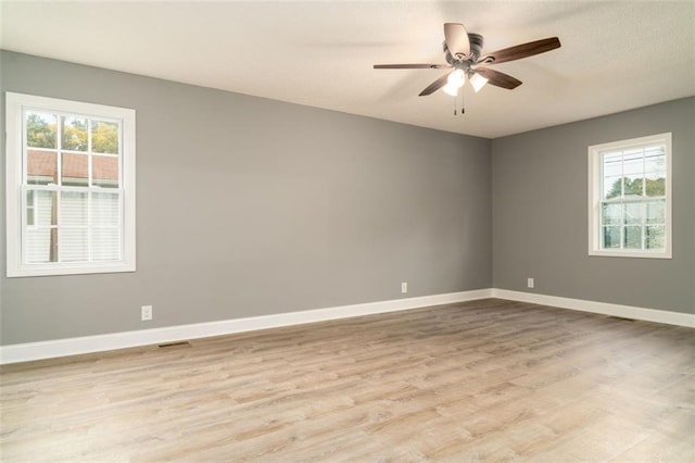 1912 Wax Rd, Aragon, GA 30113 - empty room featuring plenty of natural light, wood finished floors, baseboards, and ceiling fan