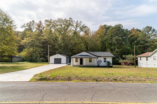 1912 Wax Rd, Aragon, GA 30113 - view of front facade with a detached garage, an outdoor structure, a front yard, driveway, and board and batten siding